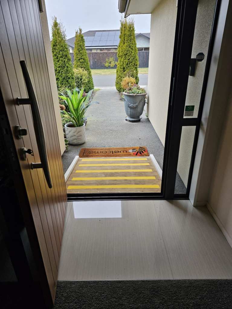 A ramp built quietly by a neighbour — a small slope, a lighter step, a path made easier.